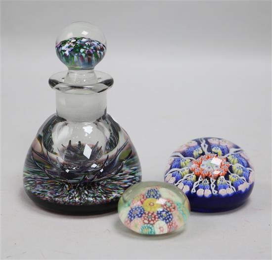 Two paperweights and a glass scent bottle